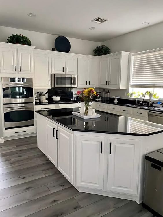 White kitchen with black countertops sanitized by VIP Cleaning Squad in Niagara-on-the-Lake