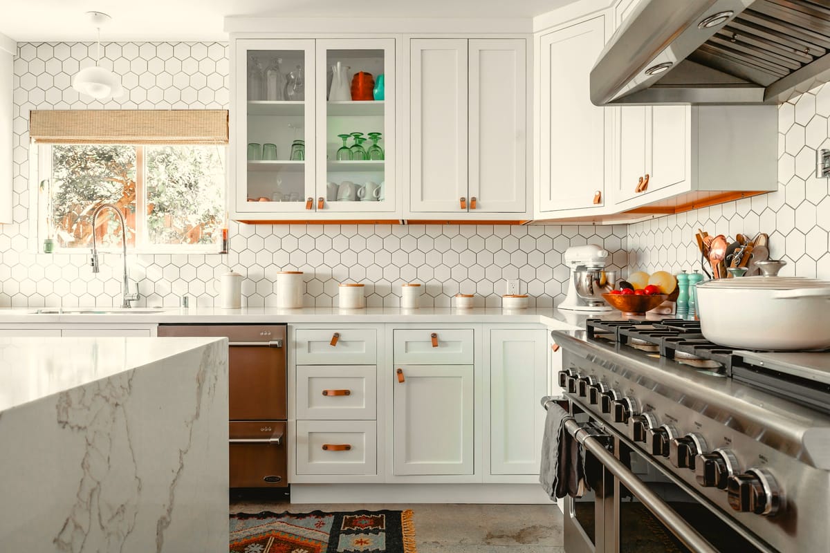 Spotless white kitchen after a professional clean